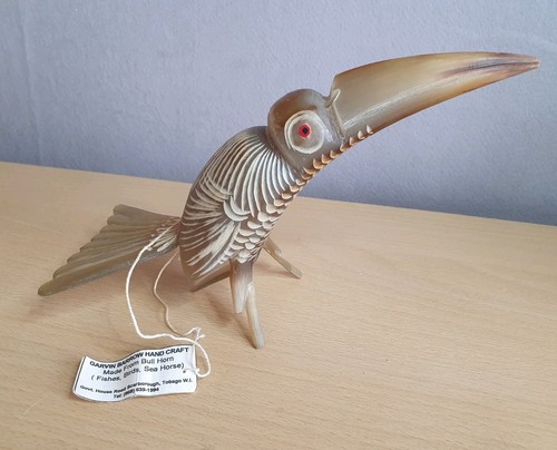 Hand carved bull horn - hand, bird